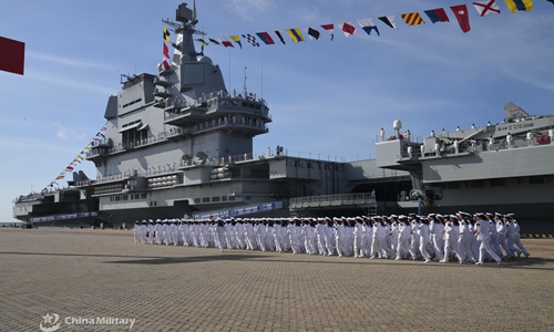 The picture shows aircraft carrier Shandong berths at a naval port in Sanya. China's first domestically-made aircraft carrier Shandong (Hull 17) was officially commissioned to the PLA Navy at a military port in Sanya, South China's Hainan Province, on the afternoon of December 17, 2019, making China one of the few countries in the world that have multiple carriers. Chinese President Xi Jinping attended the commissioning ceremony for the new aircraft carrier, which was named after China's eastern province of Shandong, and handed military flag to Senior Captain Lai Yijun, commander of the ship. Photo:China Military