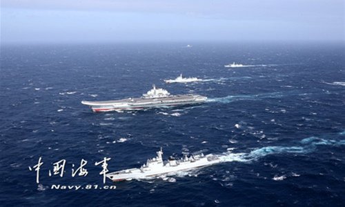 A naval formation consisting of aircraft carrier Liaoning has conducted take-off and landing drills in the South China Sea on Jan. 1, 2017. The formation, which is on a cross-sea area training exercise, involved J-15 fighter jets, as well as several ship-borne helicopters. Photo: Navy.81.cn