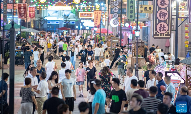 Photo taken on July 2, 2022 shows the view of a commercial street in Wuhan, central China's Hubei Province. In recent years, Hubei Province has striven to combine its night economy with culture and tourism in innovative ways, thus enhancing the vitality and attraction of nighttime consumption.(Photo: Xinhua)