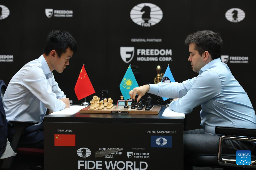 Russia's Ian Nepomniachtchi reacts as China's Ding Liren speaks after their  tiebreaker of FIDE World Chess Championship in Astana, Kazakhstan, Sunday,  April 30, 2023. China's Ding Liren defeated Russia's Ian Nepomniachtchi in