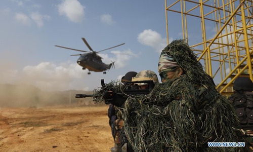 Soldiers take part in the Dragon Gold 2020 joint drill in Cambodia's southwestern Kampot province, March 26, 2020. Cambodia and China launched the fourth joint drill on counter-terrorism and humanitarian rescue at the Techo Sen Chumkiri live-fire field in Cambodia's southwestern Kampot province on March 15. The exercise dubbed Dragon Gold 2020 will last till April 1. (Xinhua) 