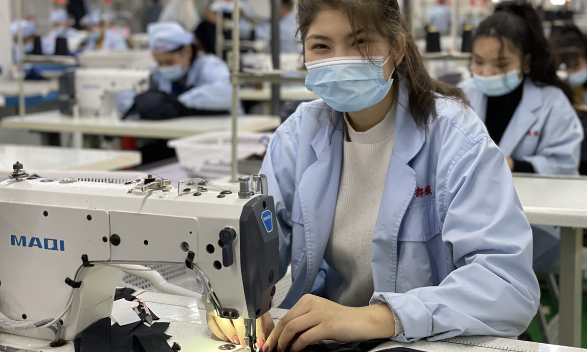 A worker in the Pomegranate Seed Garment Co. in Northwest China's Xinjiang Uygur Autonomous Region agrees to have her photo taken. Photo: Fan Lingzhi/GT