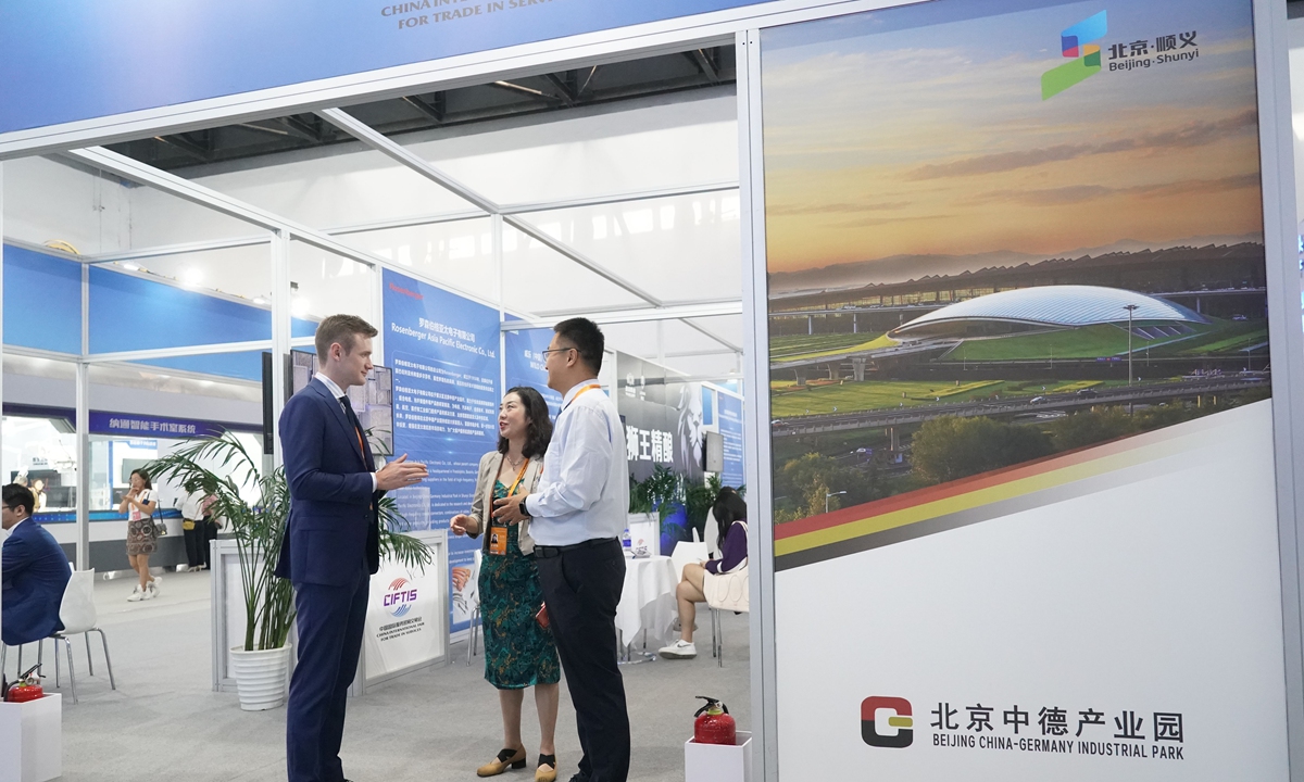 Participants at an exhibition booth of the Beijing China-Germany Industrial Park in the China National Convention Center, during the 2023 China International Fair for Trade in Services, on September 4, 2023. Photo: Xinhua