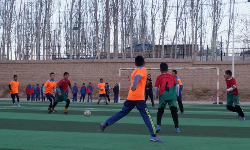 Students at Eksak Elementary School play a football game in Artux City, Northwest China’s Xinjiang Uygur Autonomous Region. Photo: Xu Keyue/GT