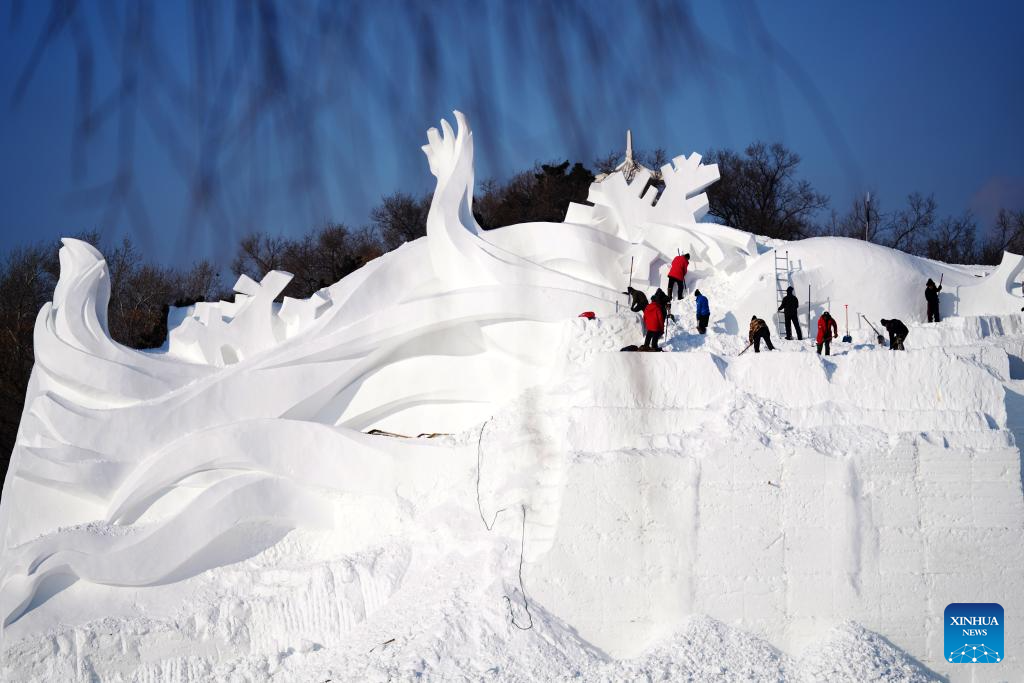 Workers use a snow gun to make artificial snow for the coming ice and snow  sculpture competition in Heihe City, northeast China's Heilongjiang  Province, 24 December, 2022. (Photo by ChinaImages/Sipa USA Stock