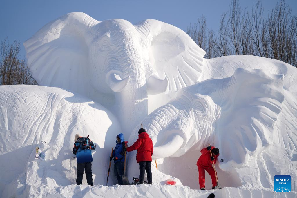 Workers use a snow gun to make artificial snow for the coming ice and snow  sculpture competition in Heihe City, northeast China's Heilongjiang  Province, 24 December, 2022. (Photo by ChinaImages/Sipa USA Stock