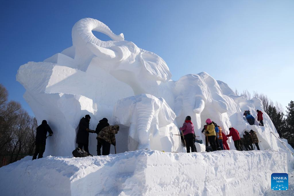 Workers use a snow gun to make artificial snow for the coming ice and snow  sculpture competition in Heihe City, northeast China's Heilongjiang  Province, 24 December, 2022. (Photo by ChinaImages/Sipa USA Stock