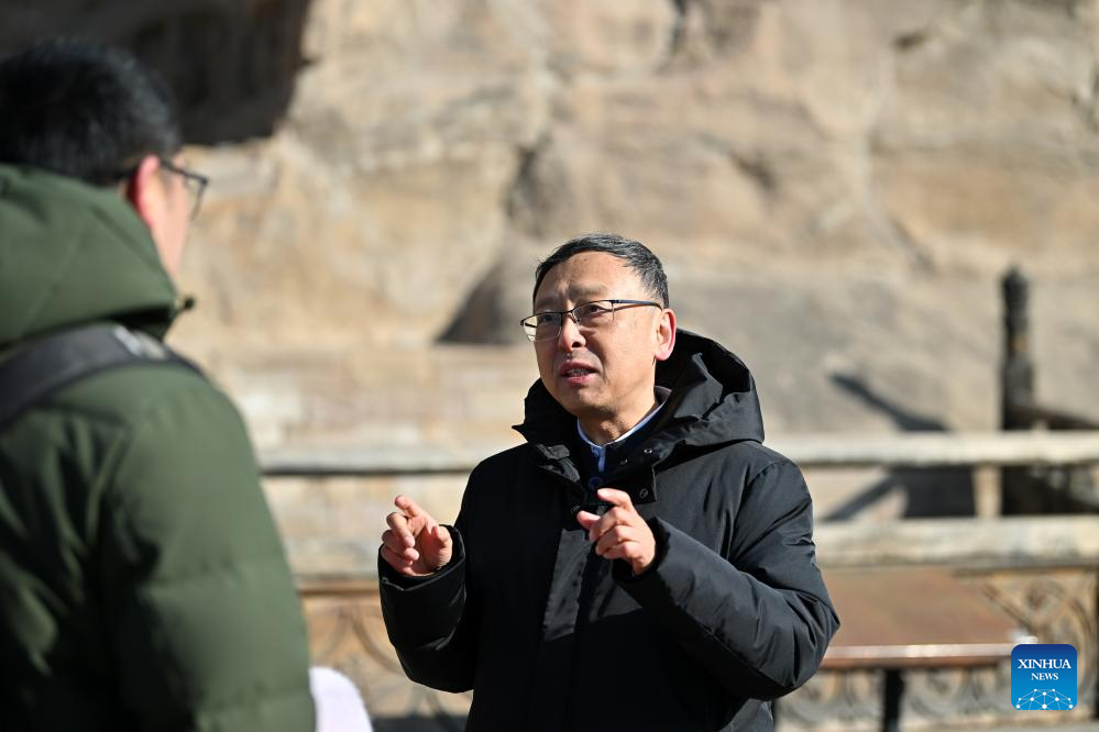 Pic story: NPC deputy promotes scientific research, personnel training of Yungang Grottoes