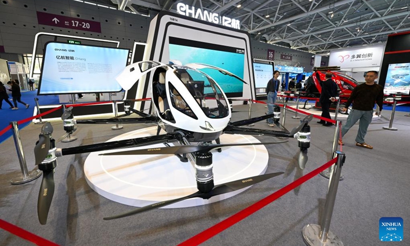 Visitors look at an aerial vehicle of EHang during the 25th China Hi-Tech Fair (CHTF) in Shenzhen, south China's Guangdong Province, Nov. 15, 2023. The 25th China Hi-Tech Fair (CHTF) kicked off here Wednesday, attracting 4,925 exhibitors from 105 countries and regions.(Photo: Xinhua)