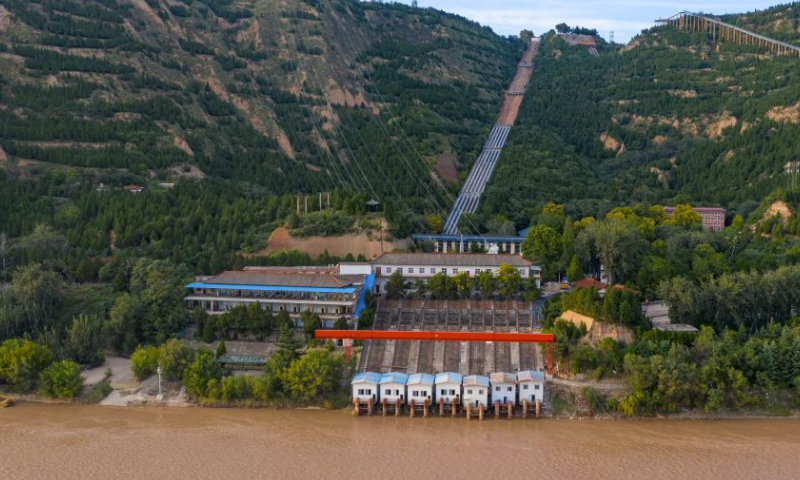 This aerial photo taken on Sept. 21, 2023 shows the Dayudu water lifting project in Ruicheng County of Yuncheng City, north China's Shanxi Province. Dayudu of Ruicheng County is named after Dayu, a legendary Chinese flood control hero who had lived and worked there more than 4,000 years ago. Overlooking the Yellow River, local residents used to suffer from drought for a long time until the Dayudu water lifting project was set up in the 1970s. Pumping stations at the irrigation area in Dayudu have witnessed constant upgrading, expansion and transformation in recent years to satisfy growing need for water, and Ruicheng itself has also turned a leading grain-producing county in China. (Xinhua/Yang Chenguang)