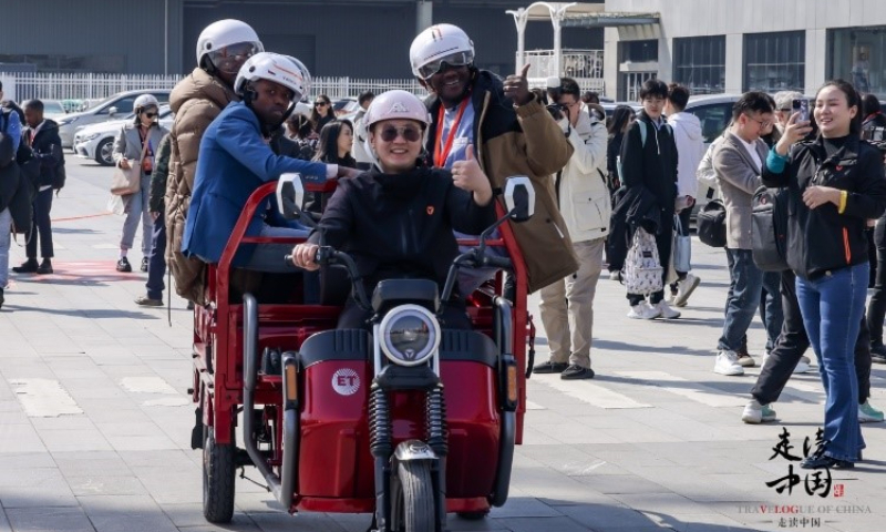 Foreign journalists ride tricycles at the Yadea Industrial Park in Wuxi, East China's Jiangsu Province on March 20, 2024. Photo: huanqiu.com