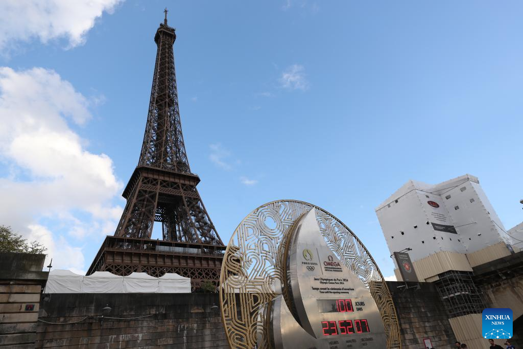 Countdown clock for Paris 2024 Olympic Games seen in front of Eiffel Tower