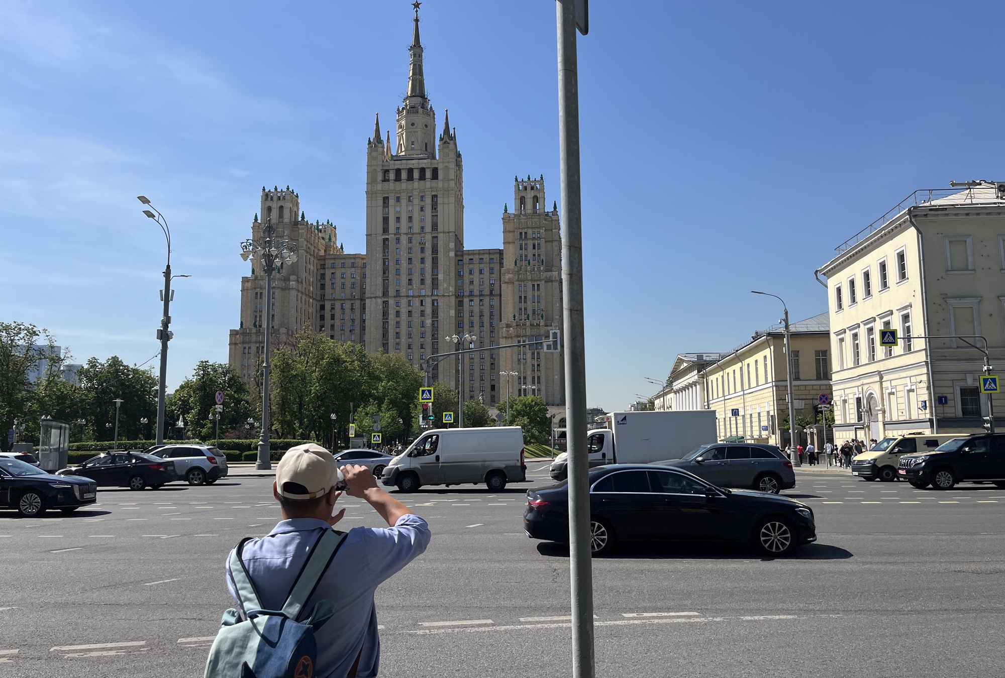 A Chinese tourist takes pictures on the street of Moscow on May 24, 2024. Photo: Chu Daye/ GT
