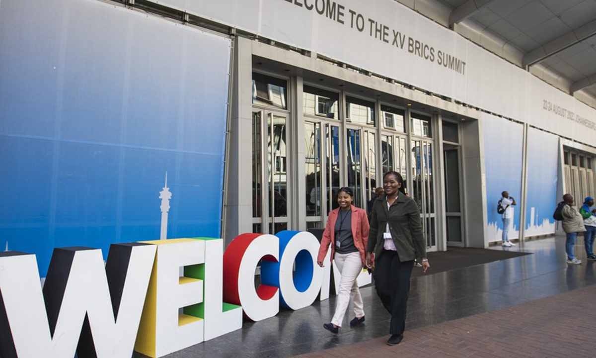 People walk near the venue of the 15th BRICS Summit in Johannesburg, South Africa, Aug. 20, 2023. (Xinhua/Zhang Yudong)