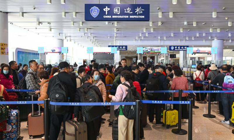 Passengers wait to go through entry procedures at Tianjin International Cruise Home Port in north China's Tianjin Municipality, March 23, 2024. As the largest cruise home port in north China, Tianjin International Cruise Home Port has handled more than 200,000 inbound and outbound passengers since its full resumption of international cruise ship transport on Sept. 27, 2023.The port is expected to welcome over 120 international cruise ships in 2024. (Xinhua/Sun Fanyue)