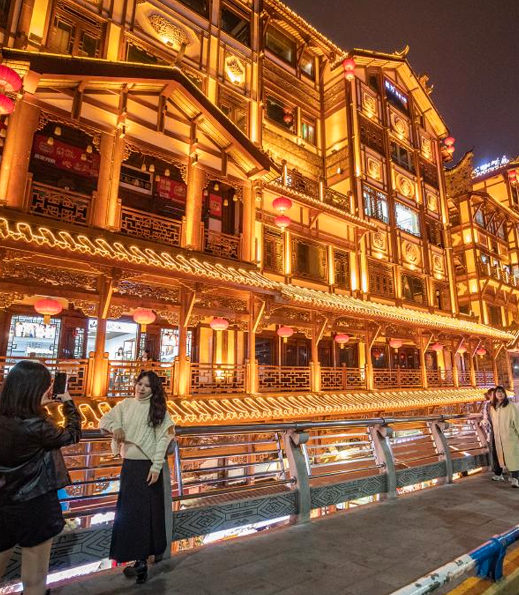 Tourists visit a commercial street in Yuzhong District in southwest China's Chongqing Municipality, Feb 10, 2023. Chongqing has launched a variety of activities at nighttime to boost night economy since the beginning of this year. Photo: Xinhua