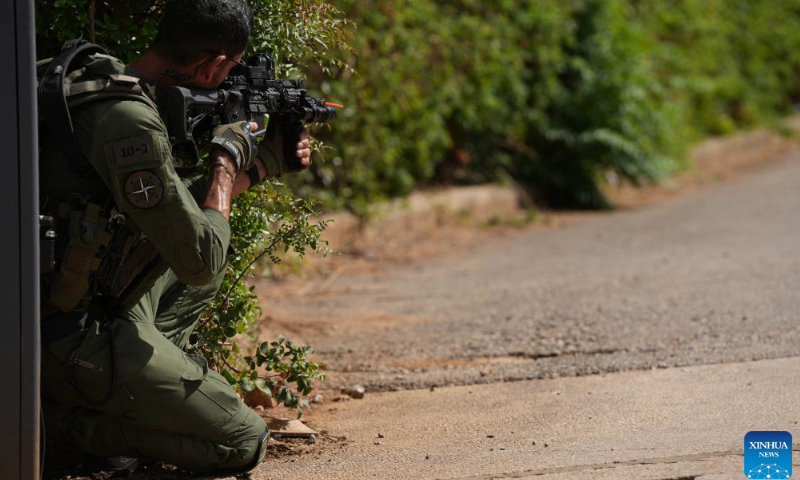 An Israeli reserve soldier takes part in a military drill in Kiryat Shmona, northern Israel, on June 18, 2024. The Israeli military announced Tuesday that it has approved 