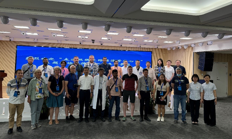 Journalists take a group picture after visiting Xinjiang Yinduolan Pharmaceutical Industry Medicine. The company has 11 classic ethnomedicine varieties and is undertaking 119 research projects, showing Xinjiang's unique research achievements and charm to foreign journalists. Photo: Chen Qingrui/GT