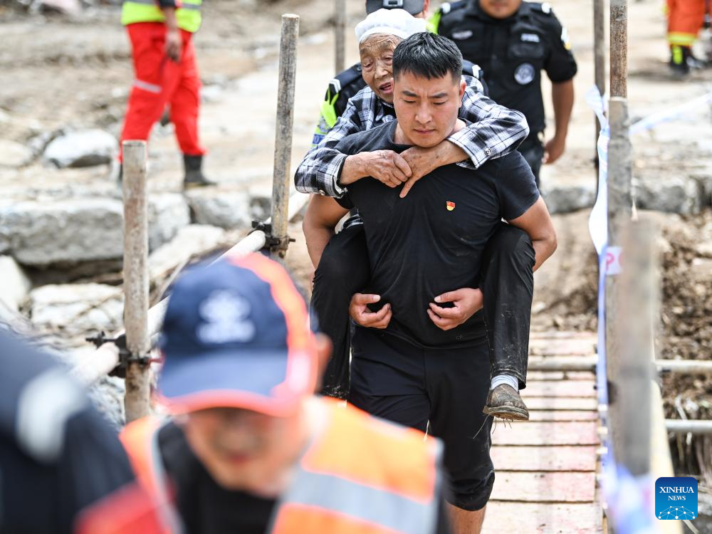 China makes all-out rescue, relief efforts after rain-triggered disasters cause severe casualties