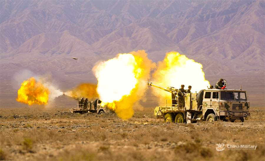 Armored vehicles open fire in the field