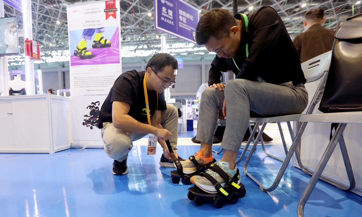 Shift Robotics, a start-up from the US, showcases its intelligent powered shoes at the CIIE that allow wearers to walk at running speeds, reaching a maximum speed of 11 kilometers per hour. Photo: Chen Xia/GT