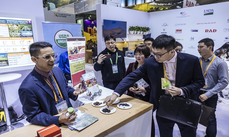 Chinese visitors try American products at an exhibition at the 7th CIIE in Shanghai on November 6, 2024. Photo: Li Hao/GT