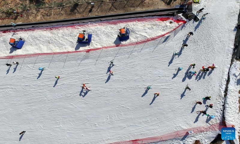 This aerial photo taken on Jan. 6, 2024 shows tourists skiing at a ski resort in Shuihou Township of Qianshan City, east China's Anhui Province. The tourist service of Shuihou Township at the foot of Tianzhu Mountain used to be limited to pure sightseeing in the mountainous areas. (Xinhua/Du Yu)