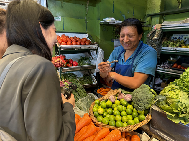 Percy Pena Angeles, a vendor at the Mercado Lobaton market in Lima, capital of Peru, talks with reporters on November 13, 2024. Photo: Wang Cong/GT