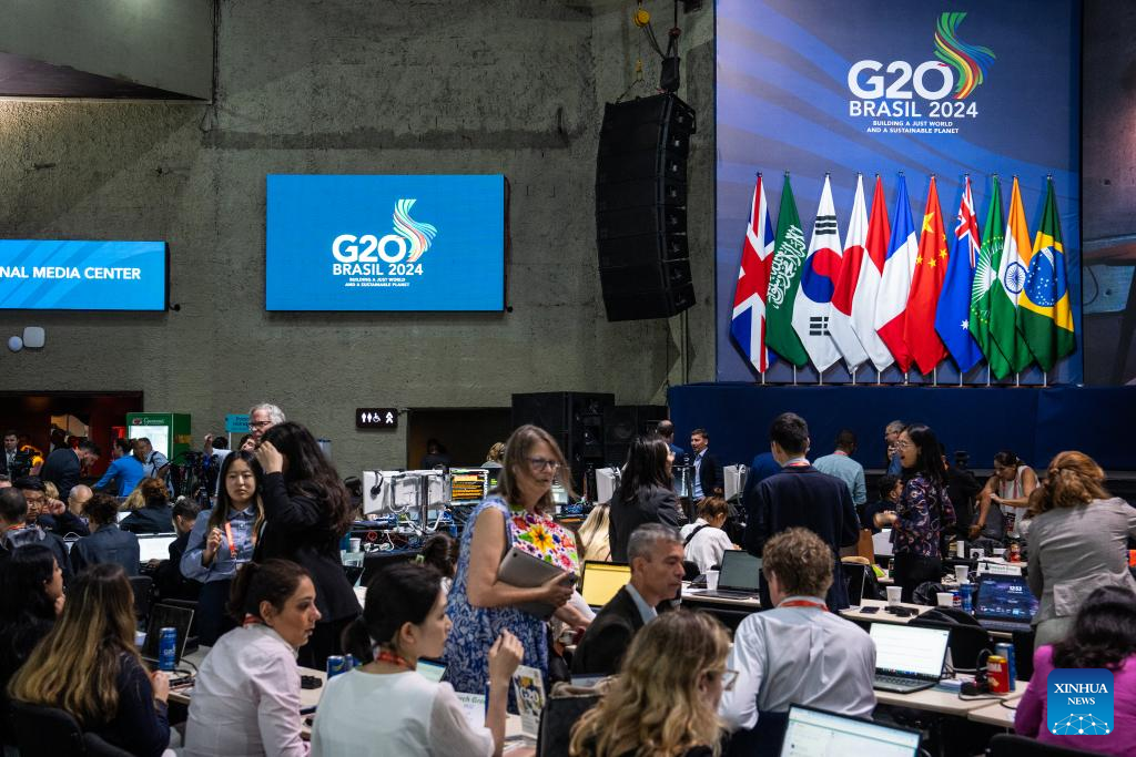 Journalists work at Int'l Media Center for G20 Summit