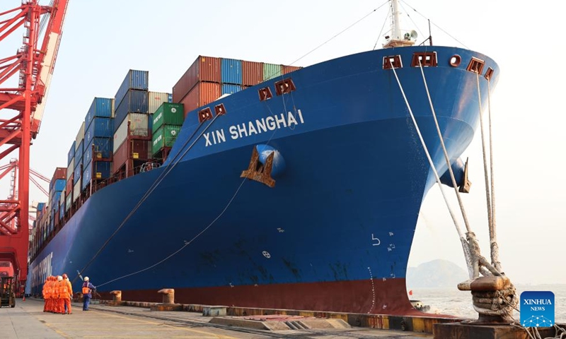 The Xin Shanghai, a vessel operated by China COSCO Shipping Corporation Limited, is berthed at Yangshan Port, east China's Shanghai, Dec. 18, 2024. The Xin Shanghai arrived in Shanghai's Yangshan Port on Wednesday afternoon after a 23-day journey from Peru's Chancay Port, marking the first official voyage between the two ports. The journey opened the first two-way operational sea link between Shanghai and Chancay Port, a newly-inaugurated flagship project of Belt and Road cooperation between China and Peru. (Xinhua/Fang Zhe)