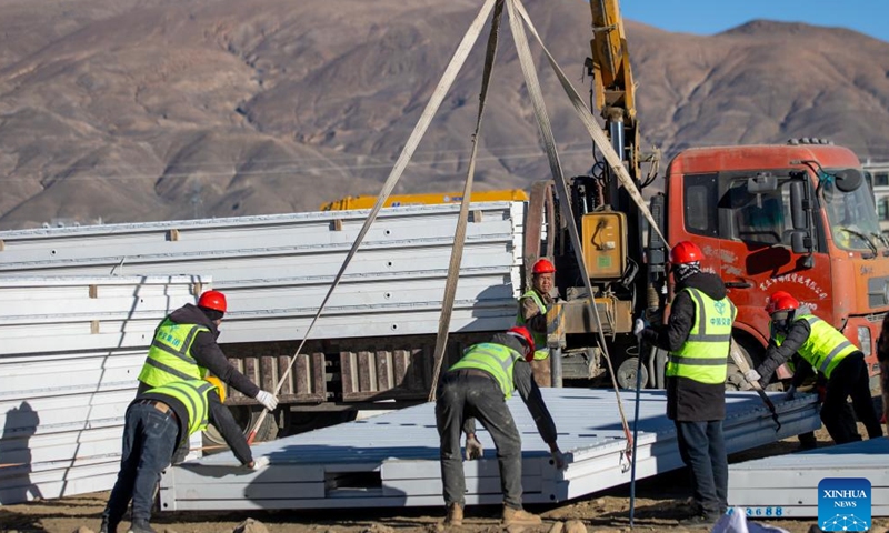 Workers build mobile houses in Quxar Township of Lnaze County in Xigaze, southwest China's Xizang Autonomous Region, Jan. 10, 2025. A total of 400 mobile houses started to be built here on Friday in quake affected Lnaza County as part of the disaster relief work after a 6.8-magnitude earthquake struck Dingri County in Xizang Autonomous Region on Tuesday morning. (Xinhua/Hu Xu)