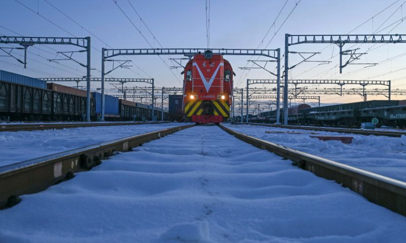 A China-Europe freight train bound for Kazakhstan waits for departure at the standard-gage yard of Horgos railway port in Horgos, northwest China's Xinjiang Uygur Autonomous Region, Dec. 25, 2024.Horgos Port, a major railway hub in Xinjiang, has facilitated 8,541 China-Europe freight train trips by Dec. 24 this year, according to statistics from the railway department of Horgos Port. (Photo by Wang Wenjie/Xinhua)