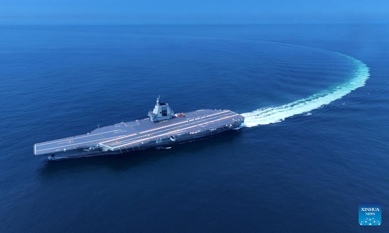 An aerial drone photo taken on May 7, 2024 shows China's third aircraft carrier, the Fujian, during its maiden sea trials. China's third aircraft carrier, the Fujian, completed maiden sea trials on Wednesday.(Photo: Xinhua)