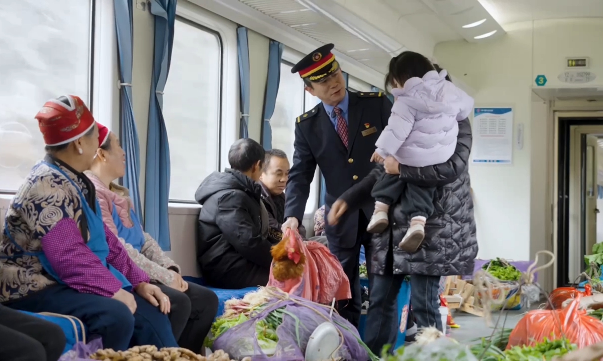 Passengers travel on a slow train running between Guiyang and Yuping in Southwest China's Guizhou Province. Photo: Chen Shuang/People's Daily