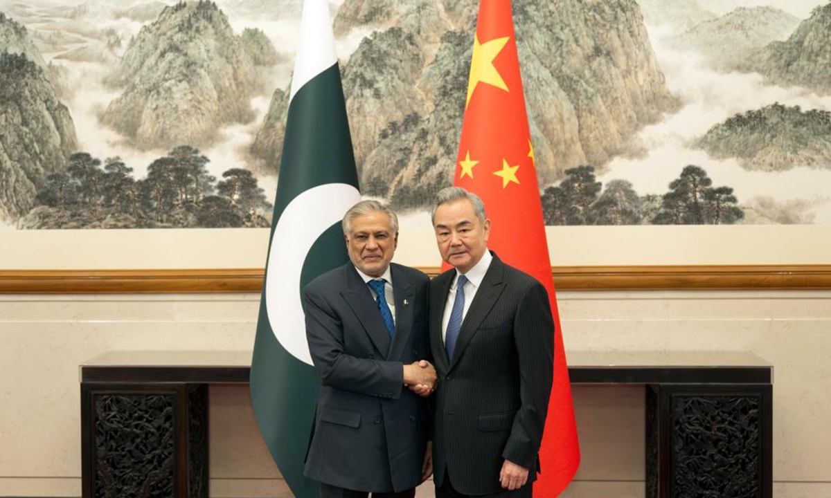 Chinese Foreign Minister Wang Yi, also a member of the Political Bureau of the Communist Party of China Central Committee, holds talks with Pakistani Deputy Prime Minister and Foreign Minister Mohammad Ishaq Dar in Beijing, capital of China on March 31, 2026. Photo: Xinhua