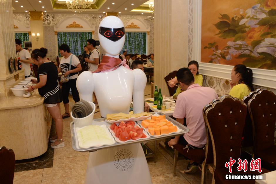 Robot waitress serves in hot pot restaurant in Chongqing
