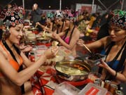 Bikini models attend hot pot banquet in Hefei