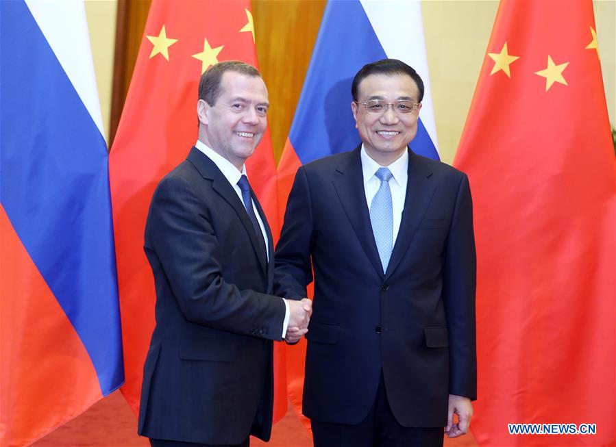China, Russia sign over 30 deals during Medvedev visit