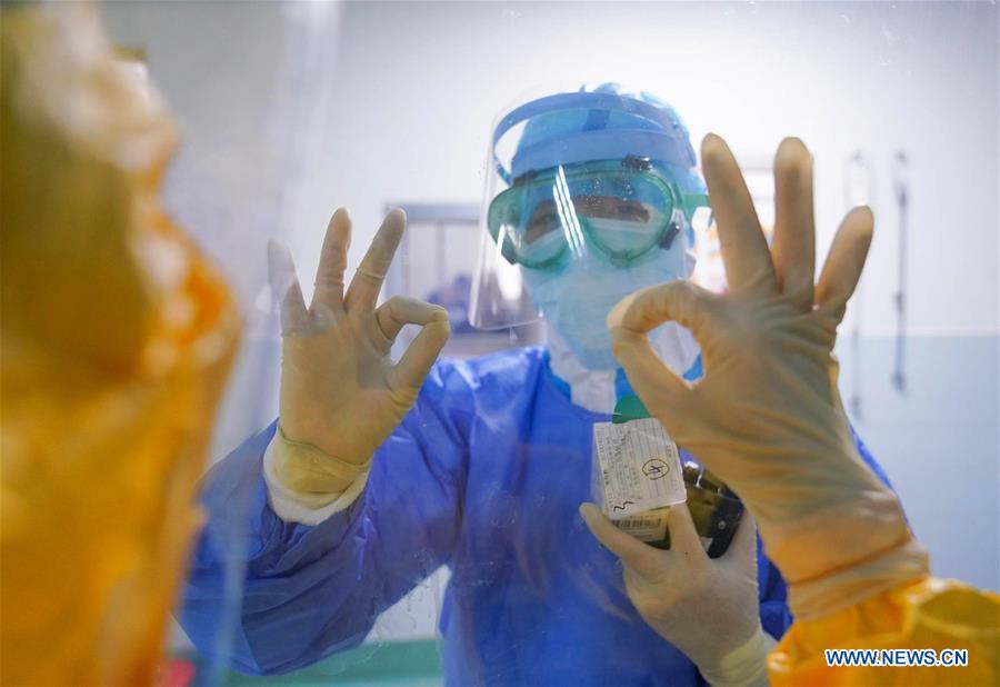 We stand alone together: Portraits in China's coronavirus battle