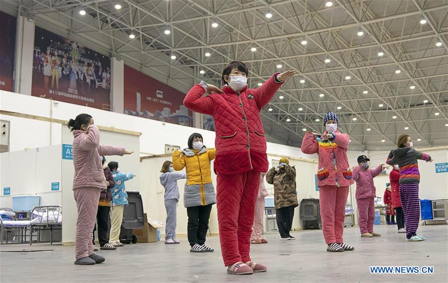 We stand alone together: Portraits in China's coronavirus battle