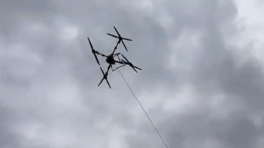 Drones deliver relief supplies to flood-hit village in Guizhou