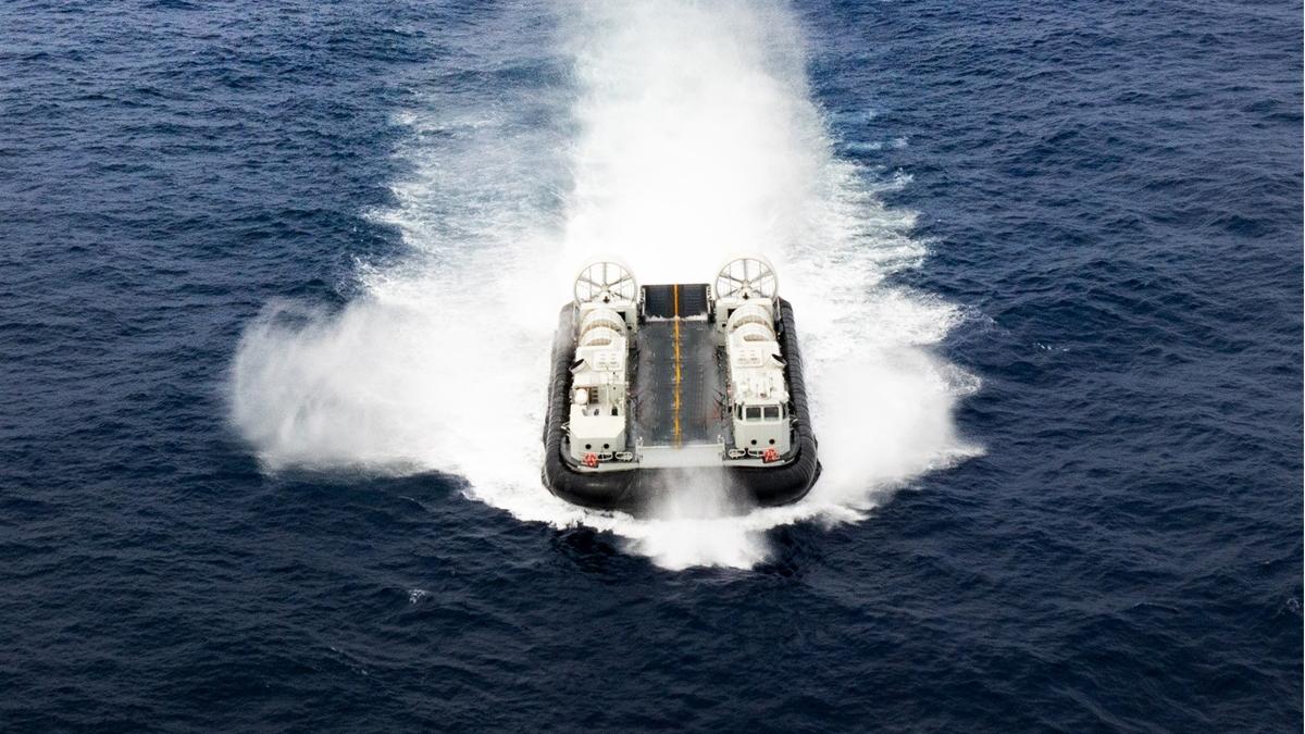 Landing craft air cushion steers into well deck