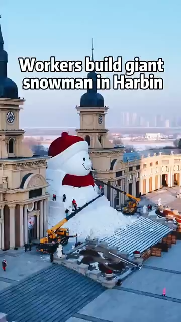 Workers build giant snowman in Harbin