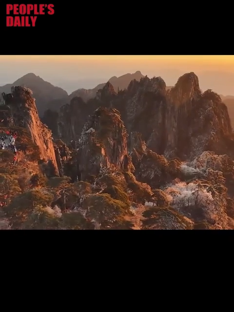 Huangshan Mountain glows in winter sunrise after fresh snowfall