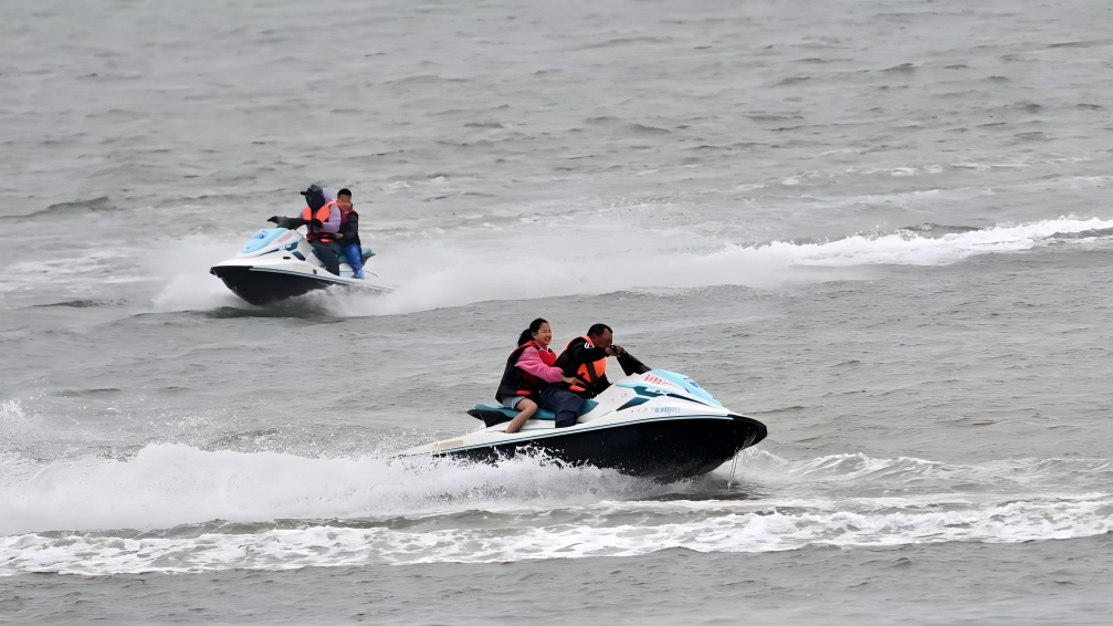 Tourists enjoy water activities in Beihai, China's Guangxi