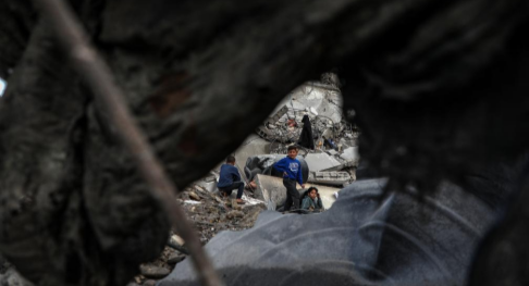 Palestinians inspect damage after Israeli airstrike in Gaza