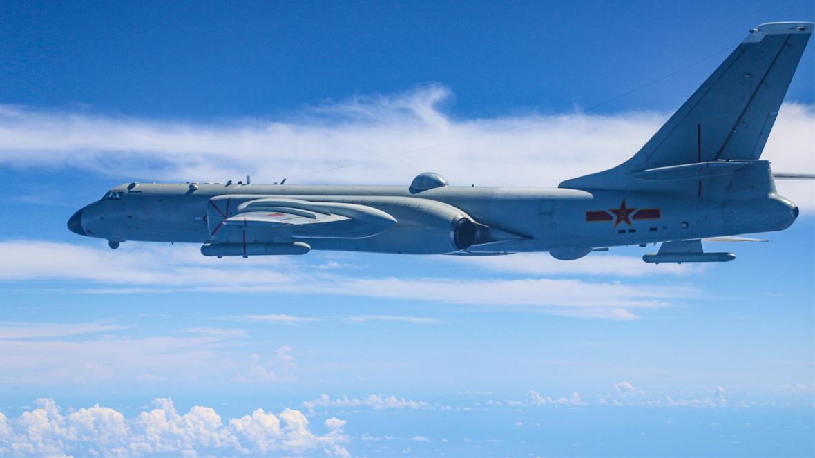 H6 bomber flies over clouds