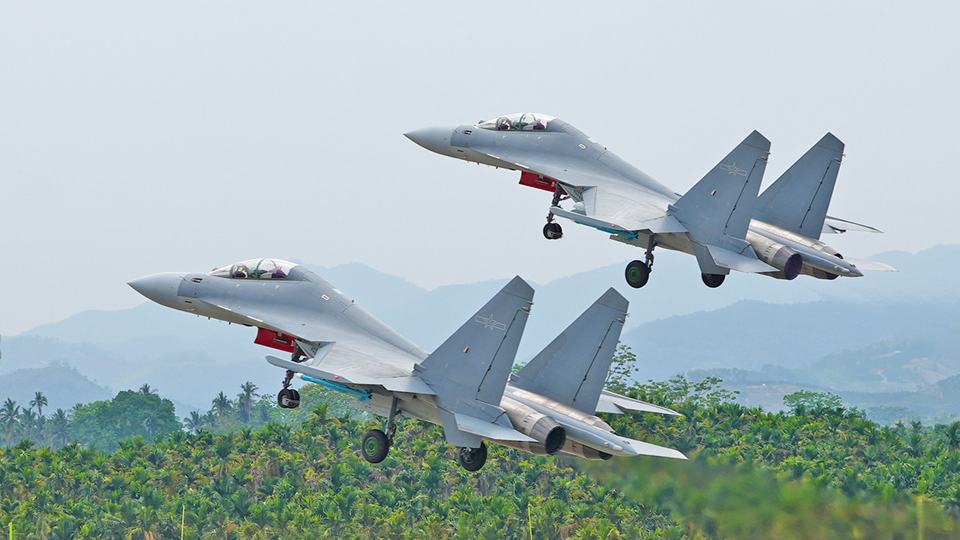 J-16 fighter jets engage in training