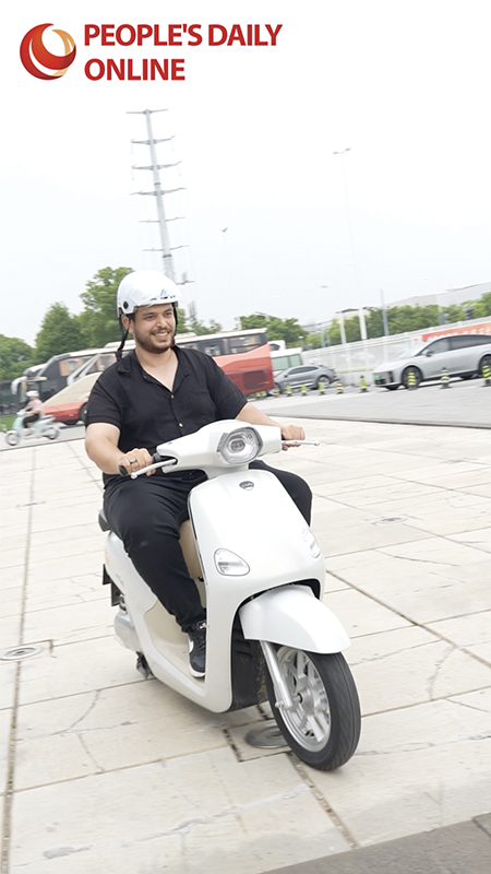 Embracing green mobility: Int'l journalists test ride Yadea's e-scooters