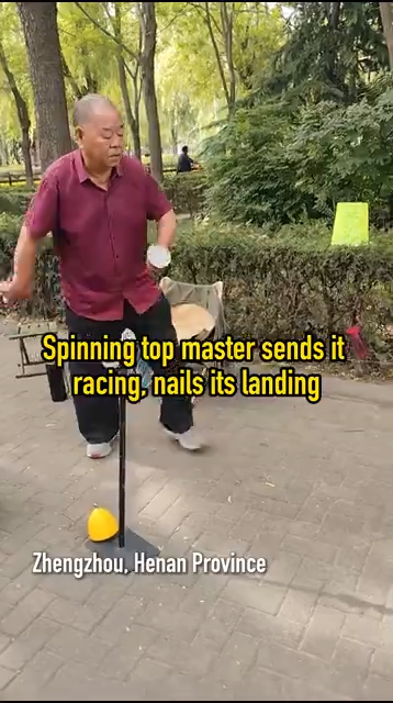 Spinning top master sends it racing, nails its landing